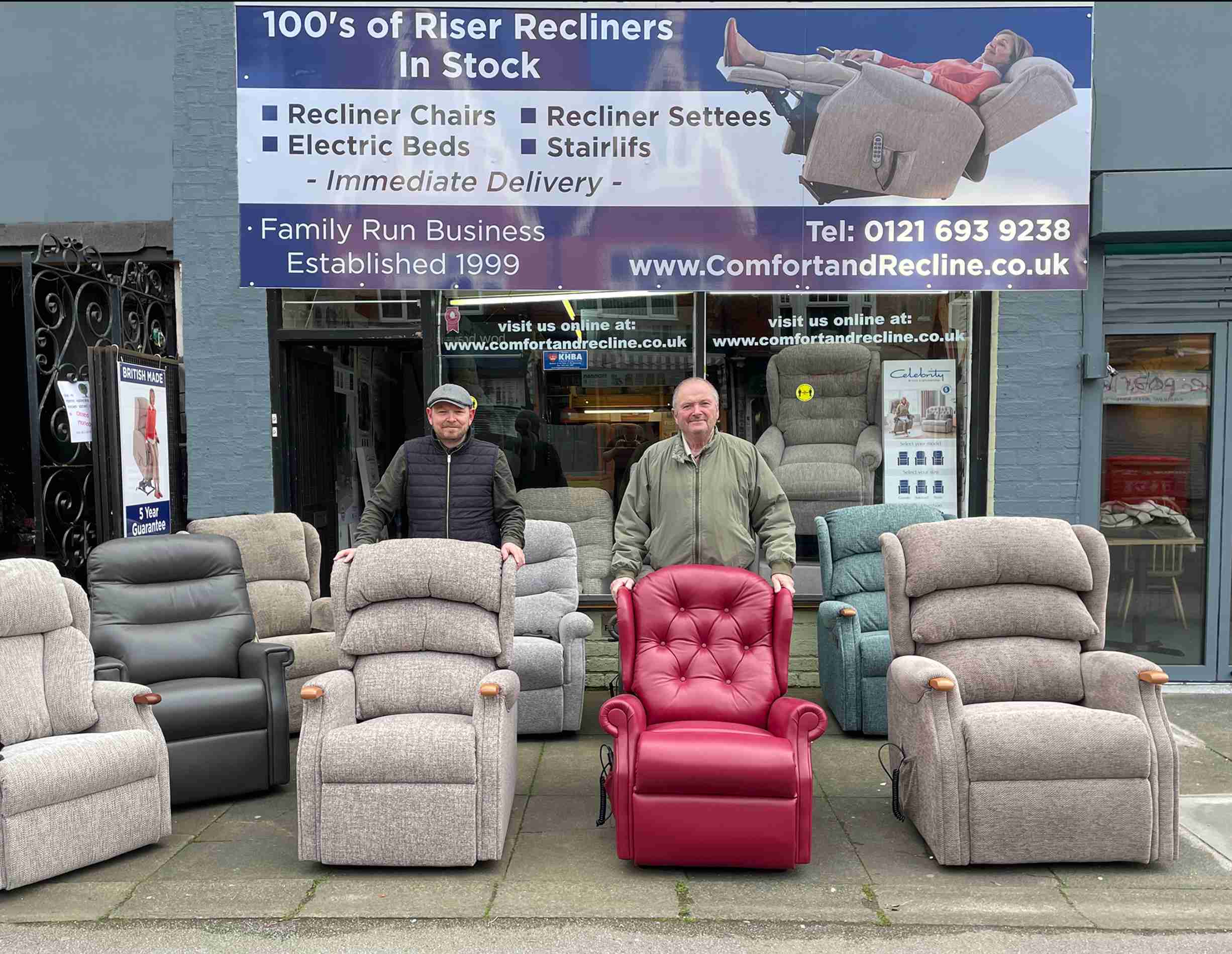 Chris and Scott standing with recliner chairs outside their Kings Heath showroom