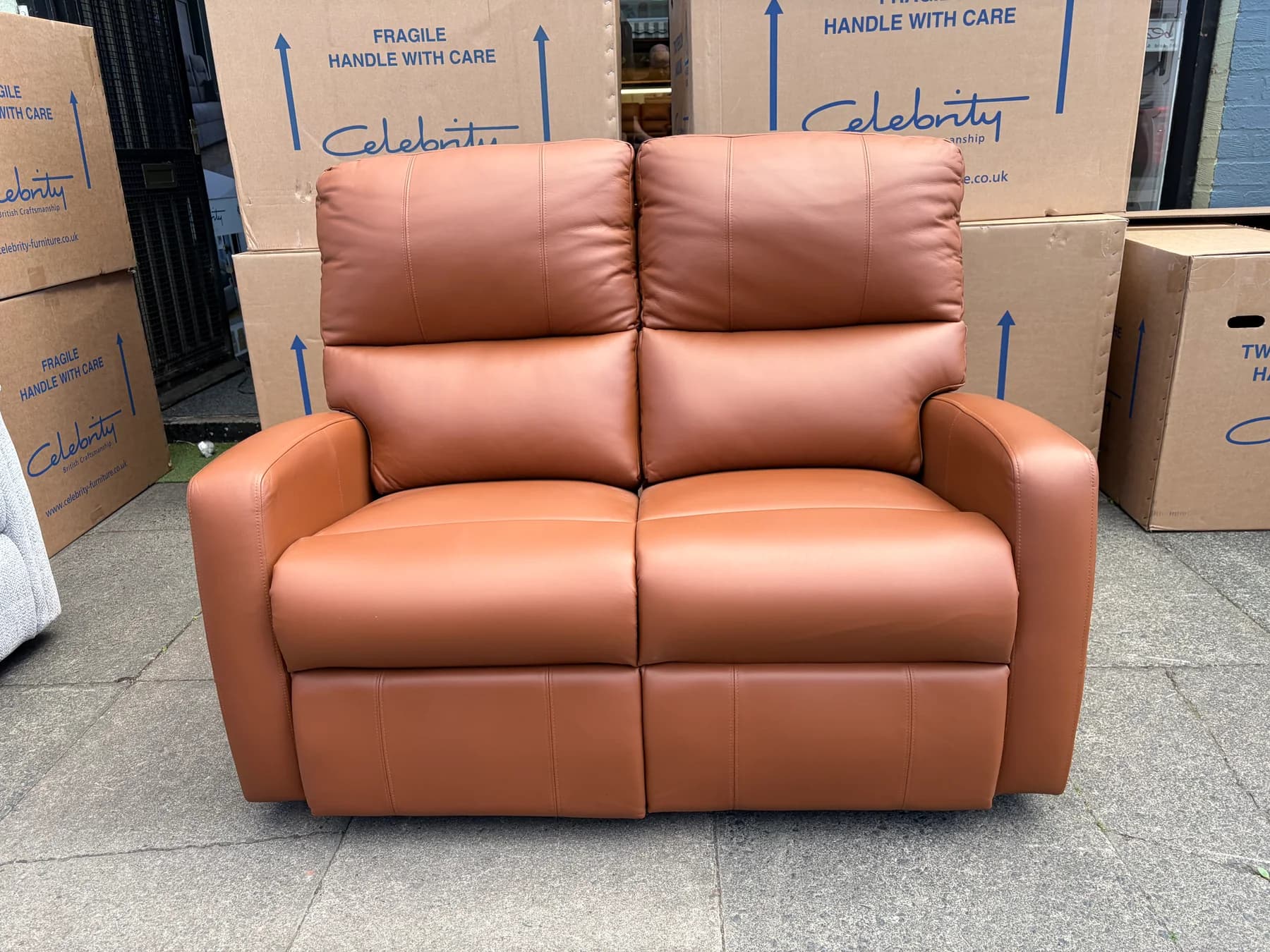 Southwell two-seater electric reclining settee in Ascot Tan leather, front view