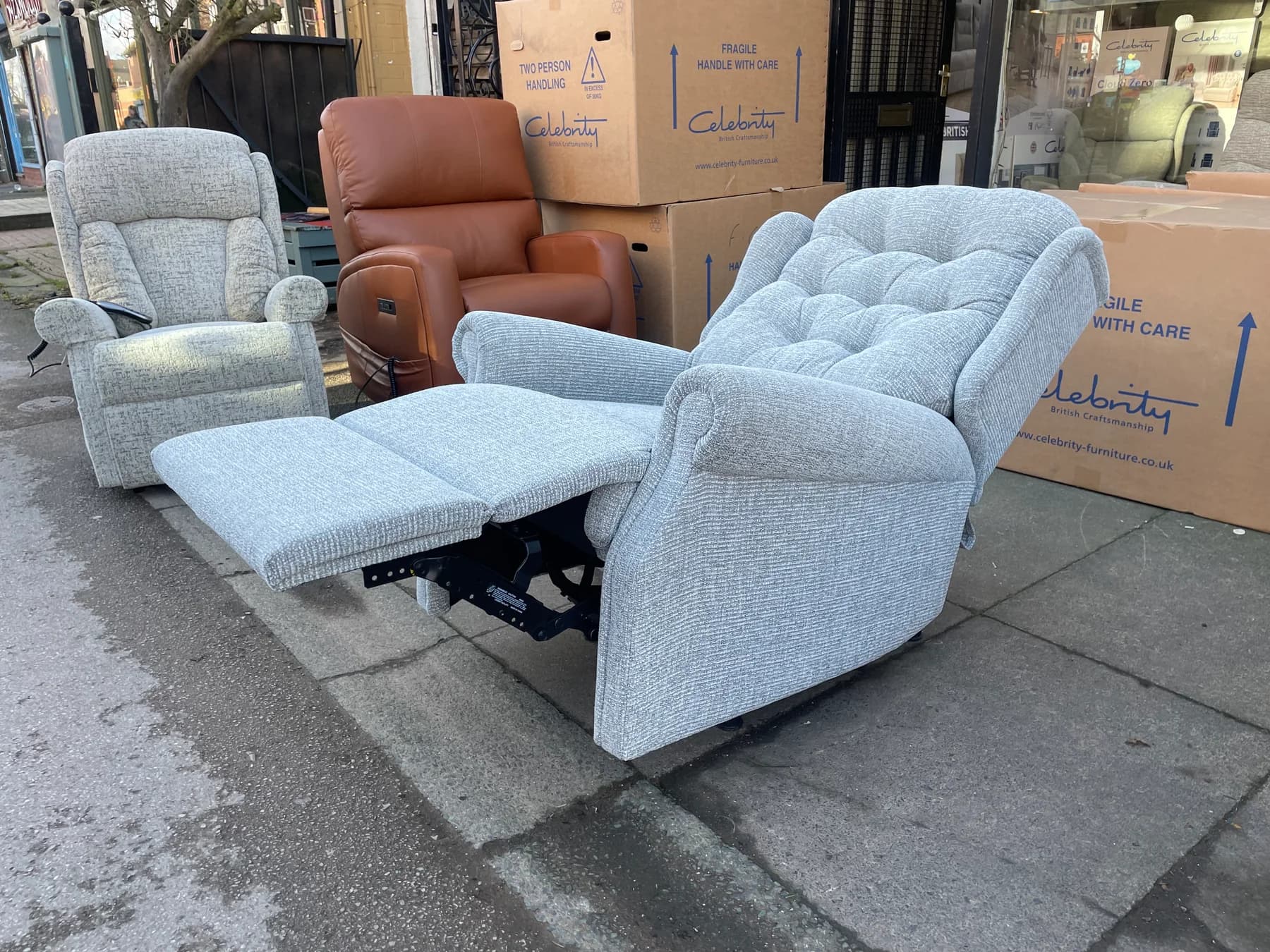 Manual recliner with its footrest extended and the moving action visible below the seat