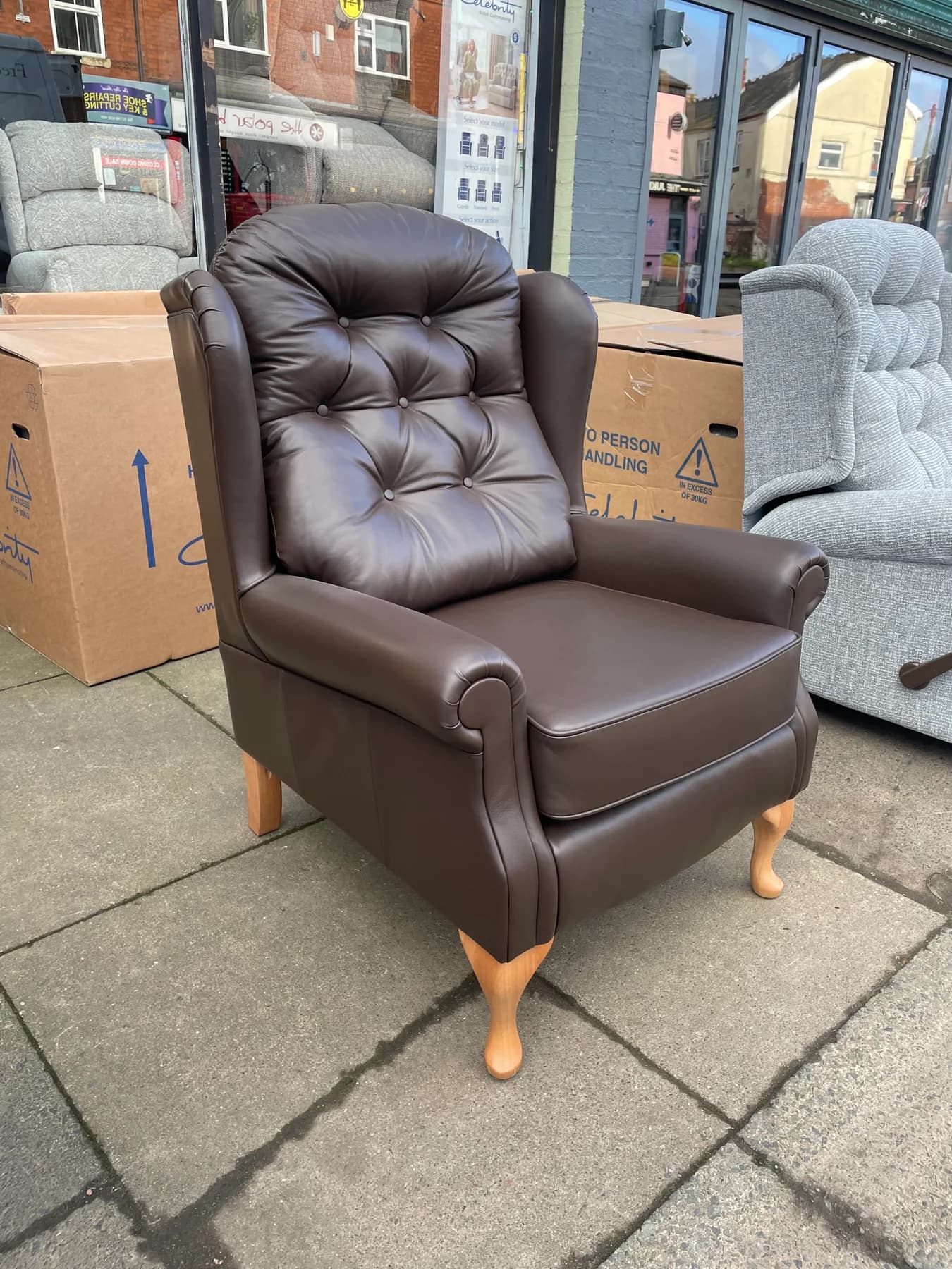 Woburn Standard legged wingchair in Coffee leather, front three-quarter view