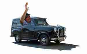 Chris O'Neill waving from the family's restored Austin A35 van